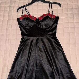 Elegant Black Dress with Red Floral Accents